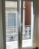 Балконная дверь двустворчатая поворотно-откидная стеклянная 1300х2100